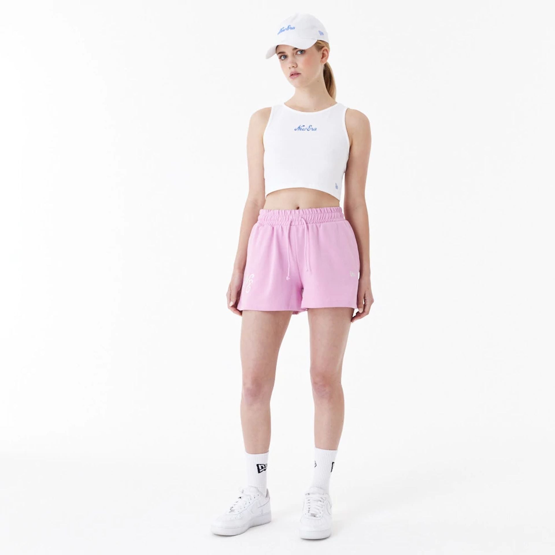 The Female model is wearing New Era Pink Womens Sweat Shorts 5