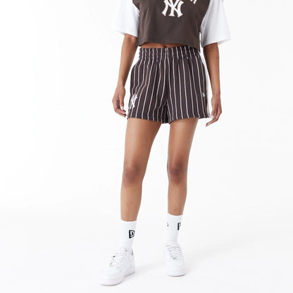 The Female model is wearing New York Yankees MLB Lifestyle Brown Shorts 6