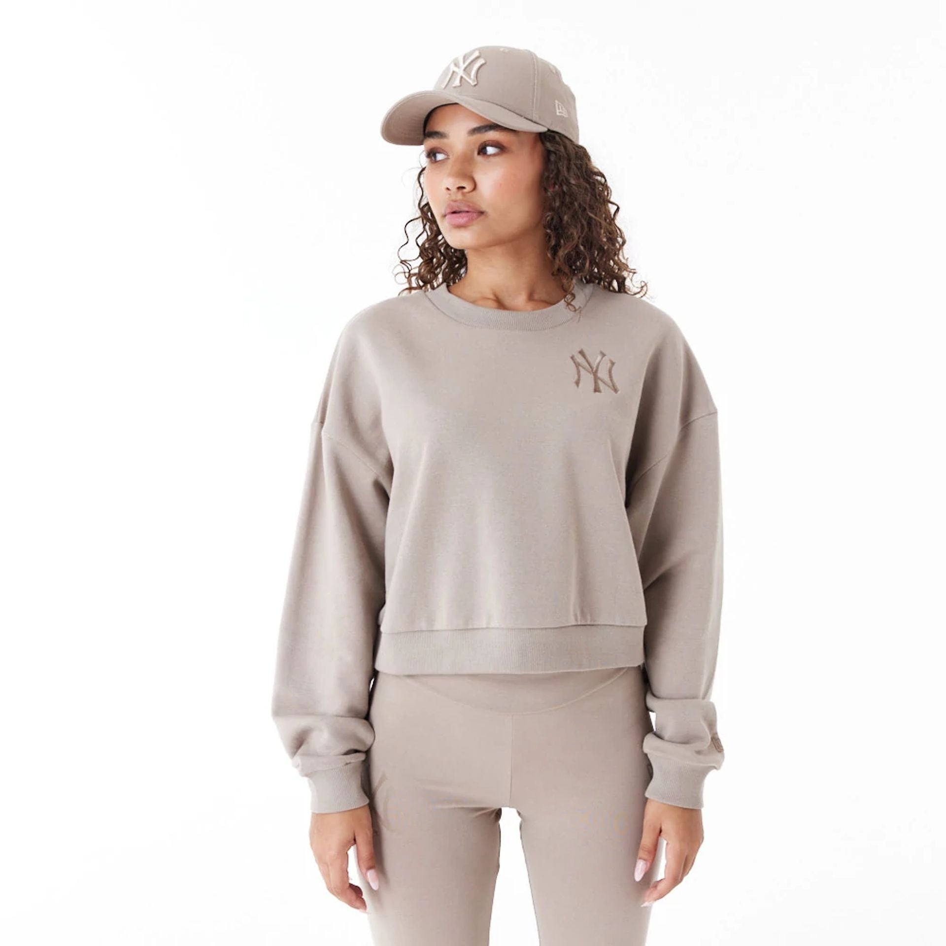 The Female model is wearing New York Yankees Womens MLB Lifestyle Brown Crop Crew Neck Sweatshirt 1