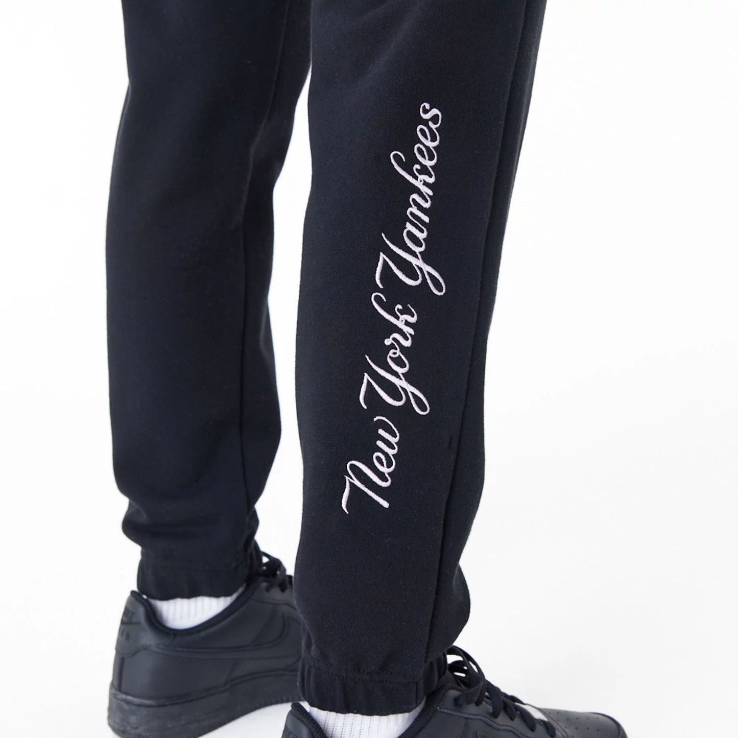 The Female model is wearing New York Yankees Womens MLB Lifestyle Black Joggers 9