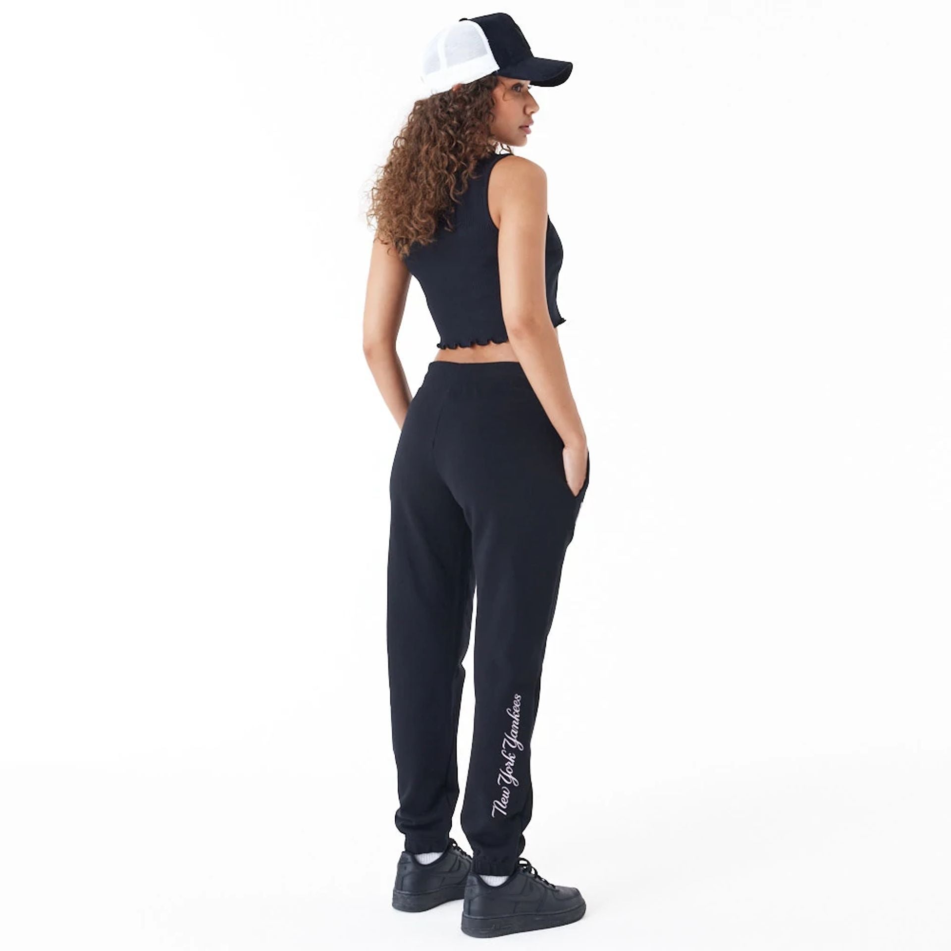 The Female model is wearing New York Yankees Womens MLB Lifestyle Black Joggers 4