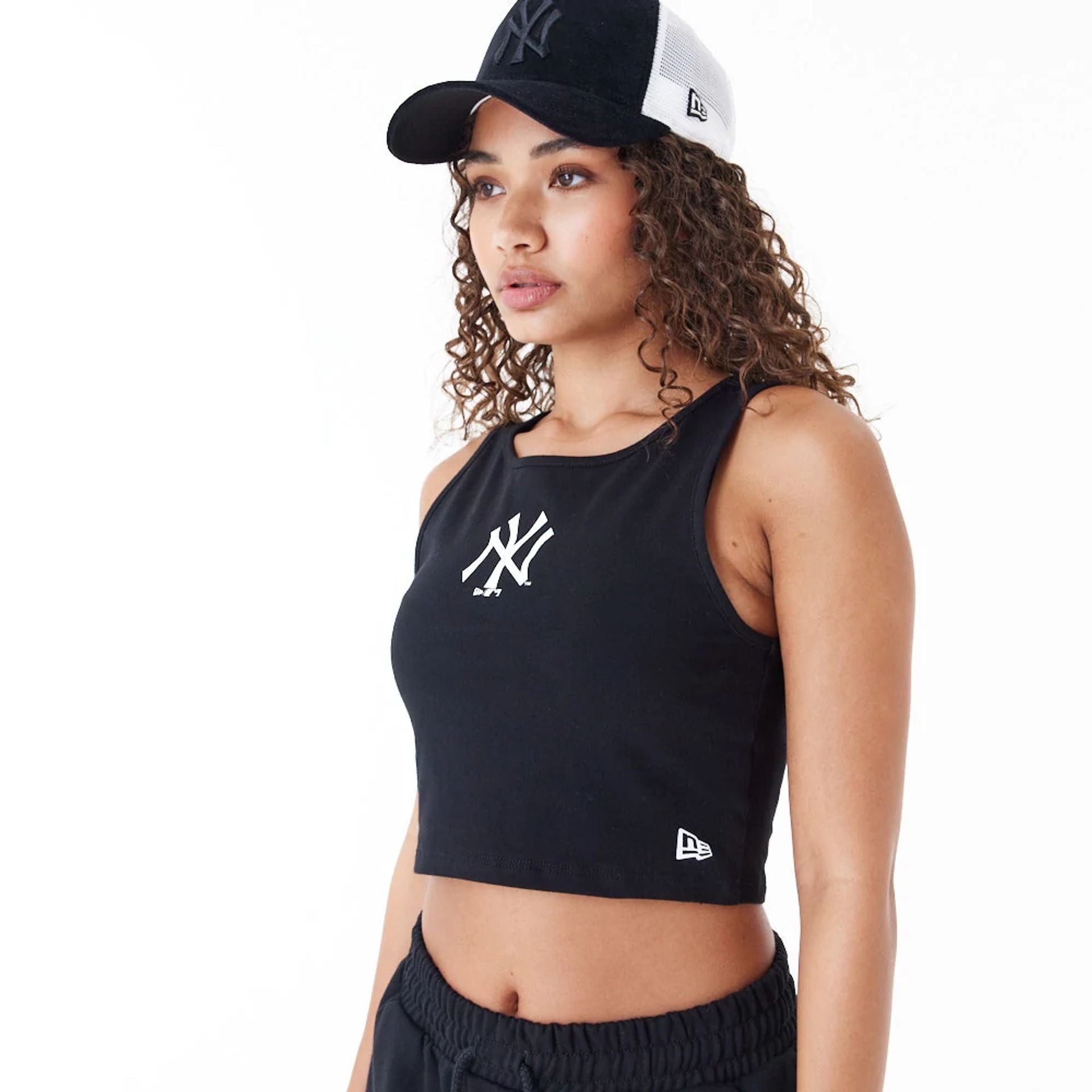 The Female model is wearing New York Yankees Womens MLB Lifestyle Black Crop Tank Top 7