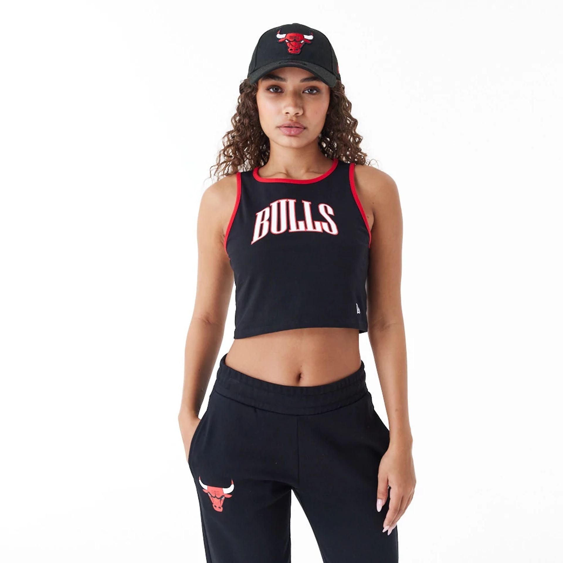 The Female model is wearing Chicago Bulls Womens Womens NBA Team Wordmark Black Crop Tank Top 1