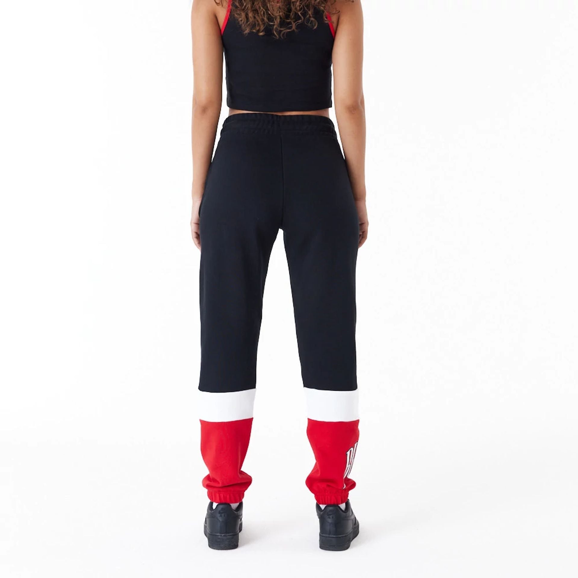 The Female model is wearing Chicago Bulls NBA Colour Block Black Joggers 6