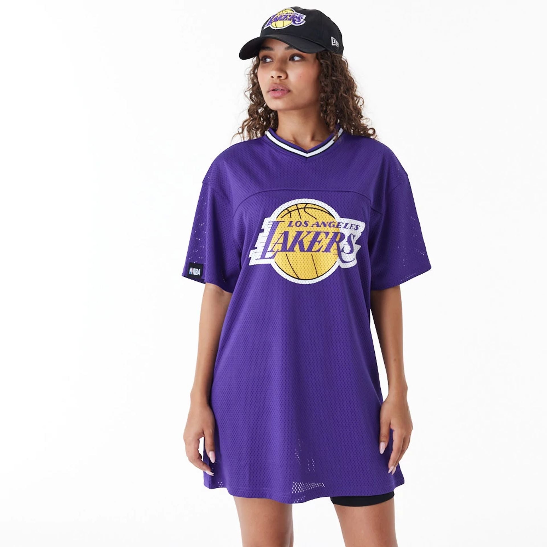 The Female model is wearing LA Lakers Womens NBA Purple Mesh Dress 1