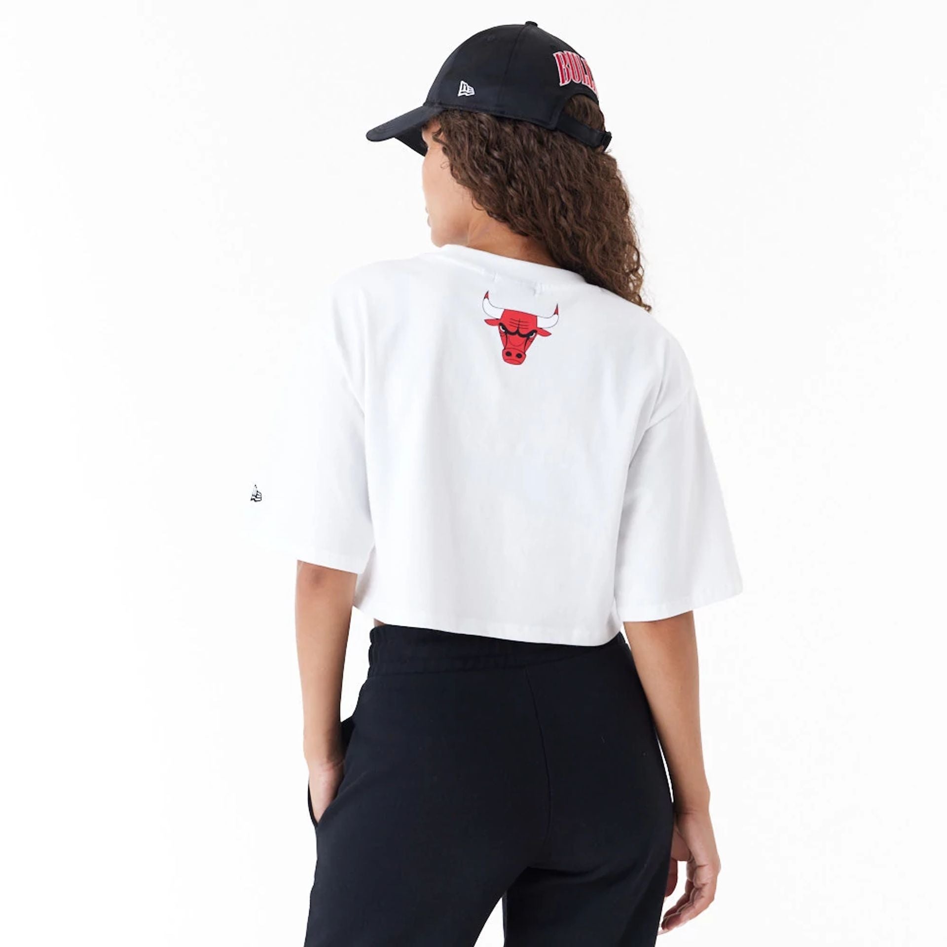 The Female model is wearing Chicago Bulls Womens NBA Team Wordmark White Crop T-Shirt 6