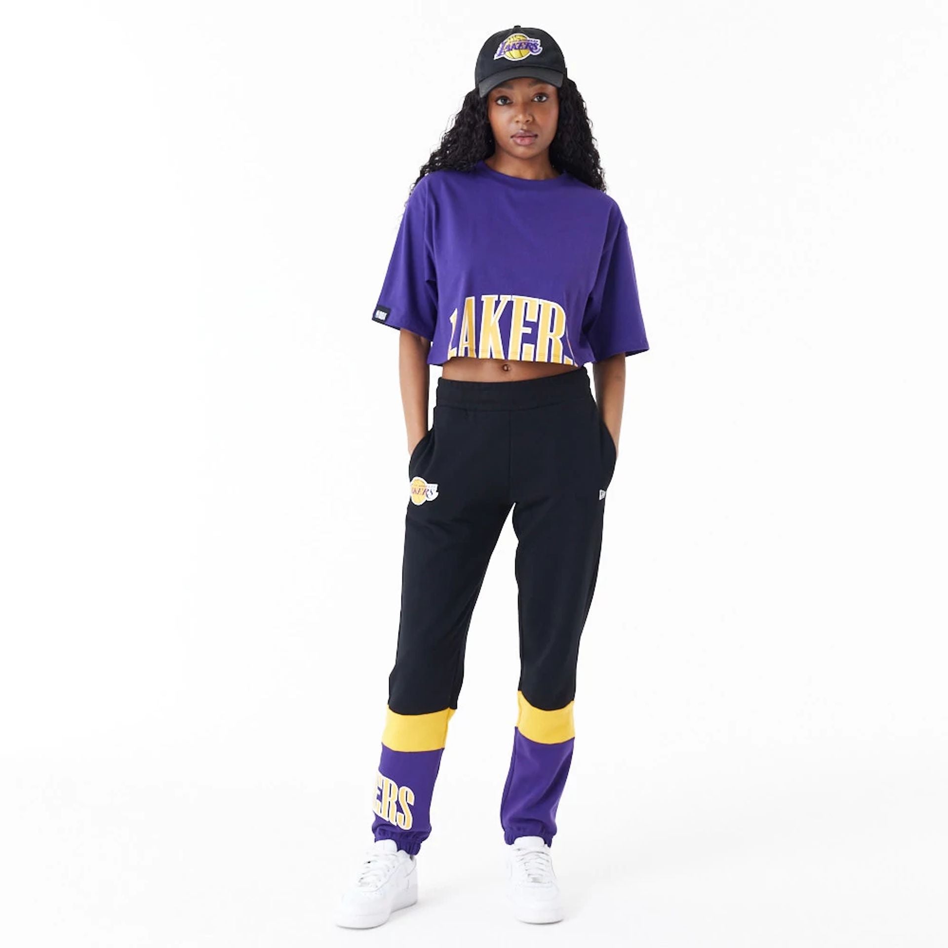 The Female model is wearing LA Lakers Womens NBA Team Wordmark Purple Crop T-Shirt 3