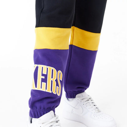 The Female model is wearing LA Lakers Womens NBA Colour Block Black Joggers 4