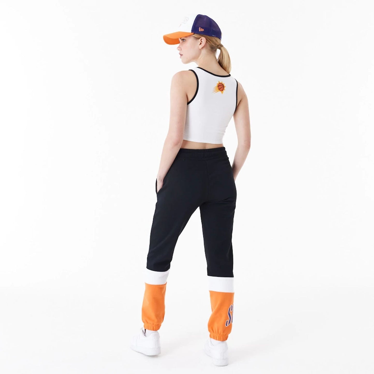 The Female model is wearing Phoenix Suns Womens NBA Team Wordmark White Crop Tank Top 2