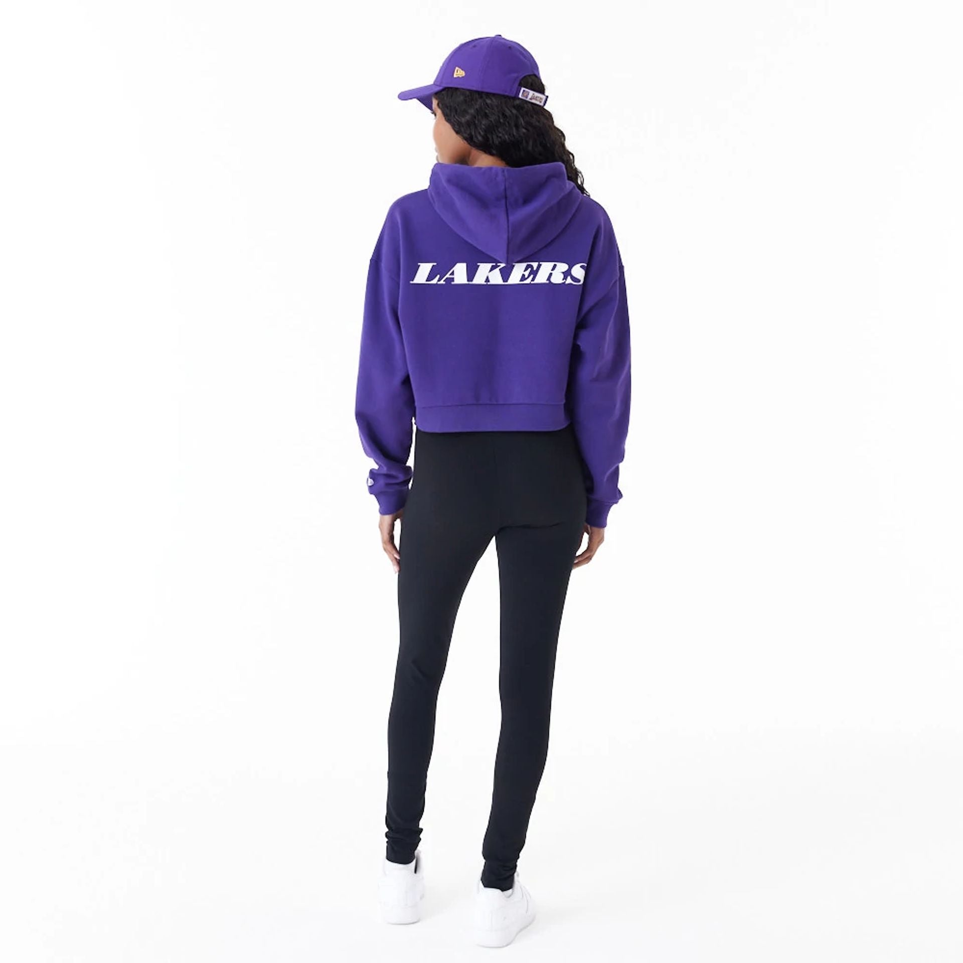 The Female model is wearing LA Lakers Womens NBA Team Logo Purple Crop Pullover Hoodie 9