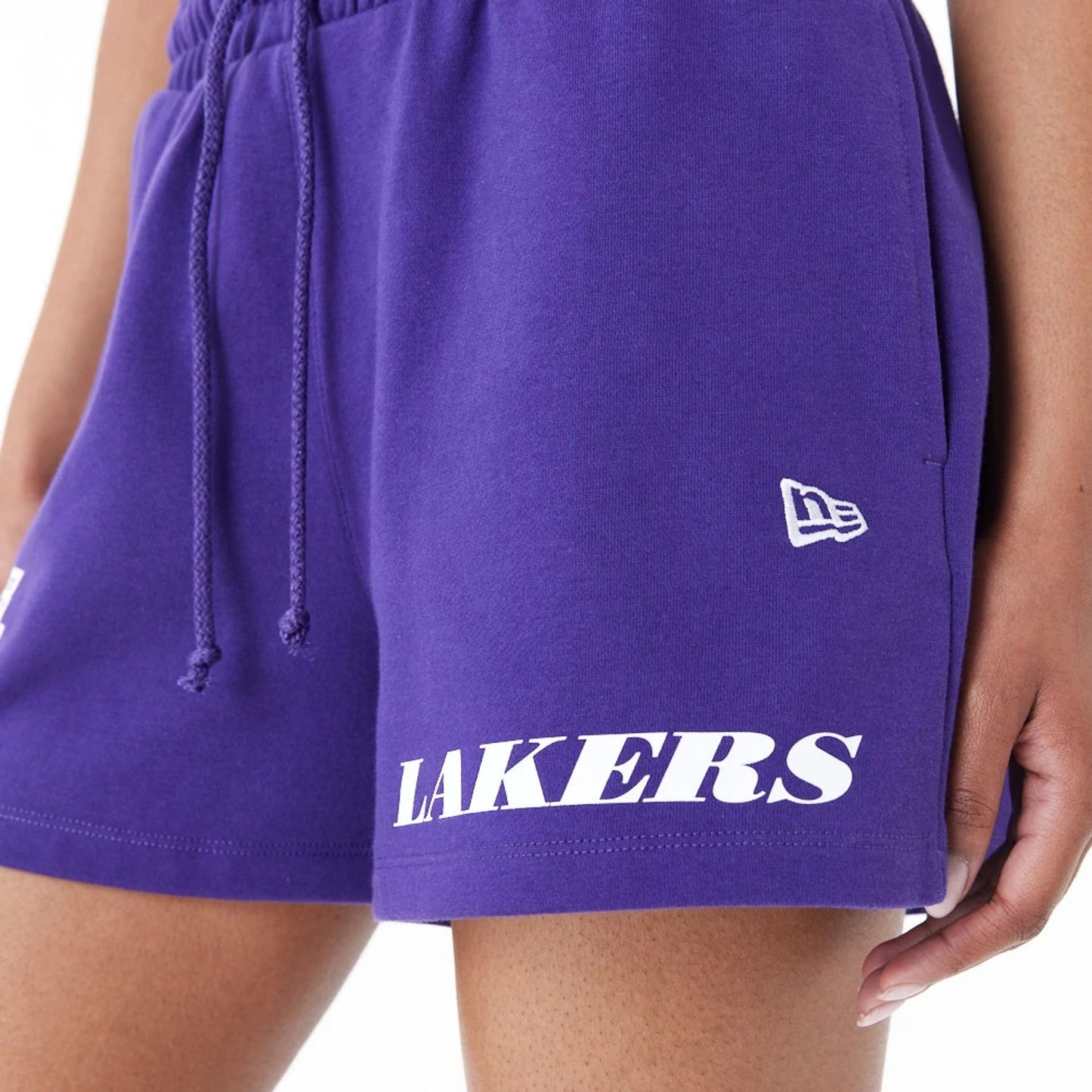 The Female model is wearing LA Lakers Womens NBA Team Logo Purple Shorts 6