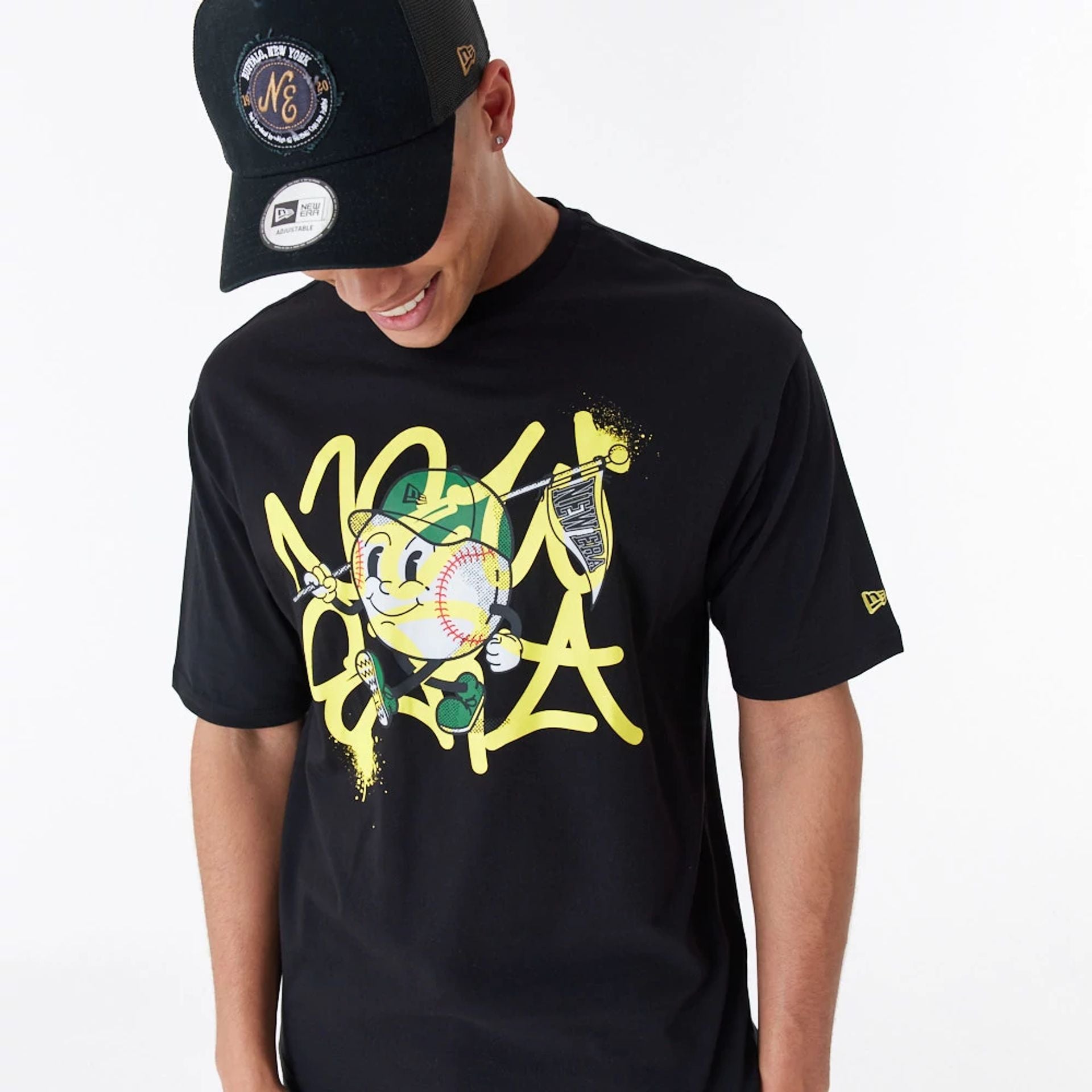 The Male model is wearing New Era Spray Graphic Black Oversized T-Shirt 2