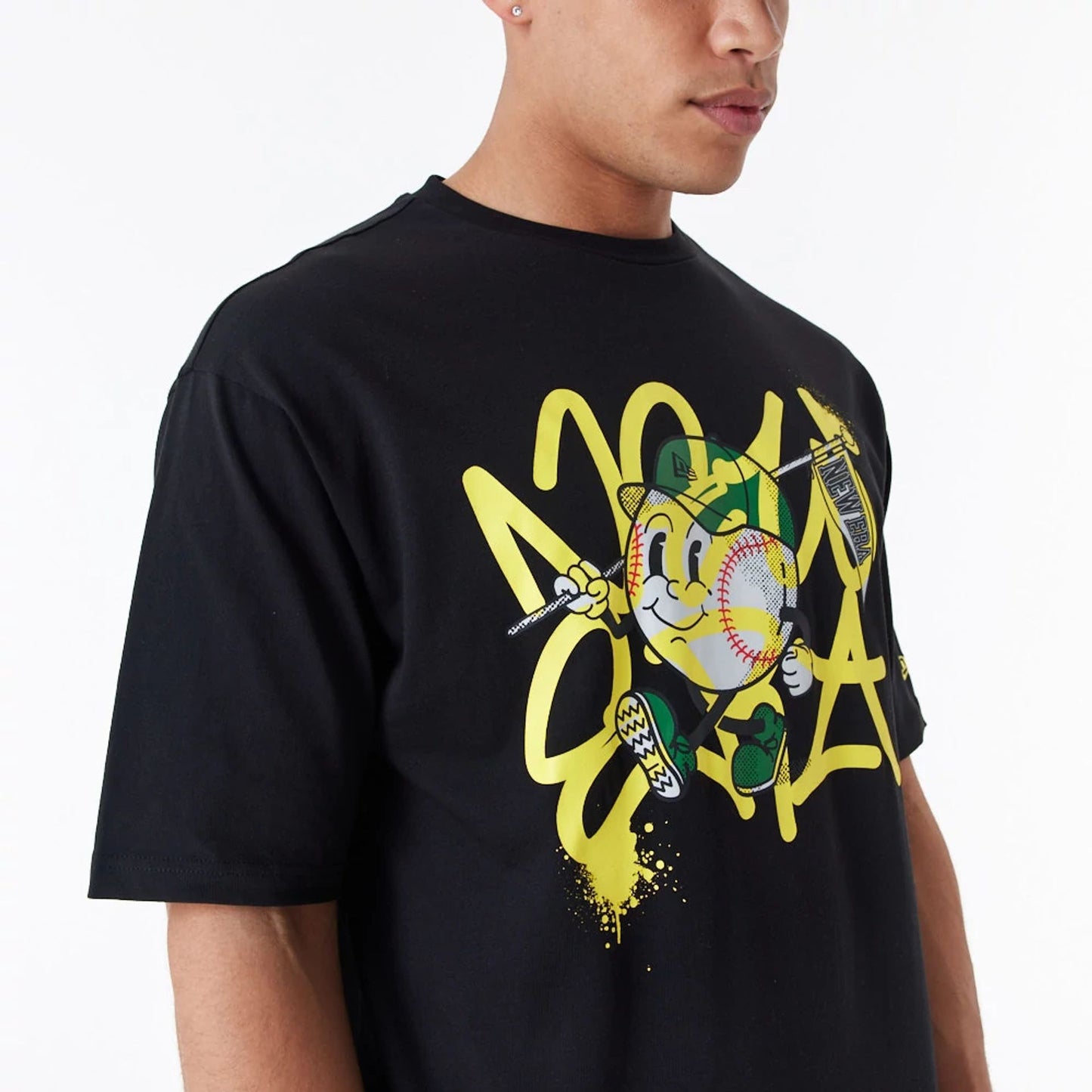 The Male model is wearing New Era Spray Graphic Black Oversized T-Shirt 5