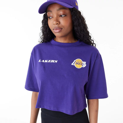 The Female model is wearing LA Lakers Womens NBA Team Logo Purple Crop T-Shirt 9