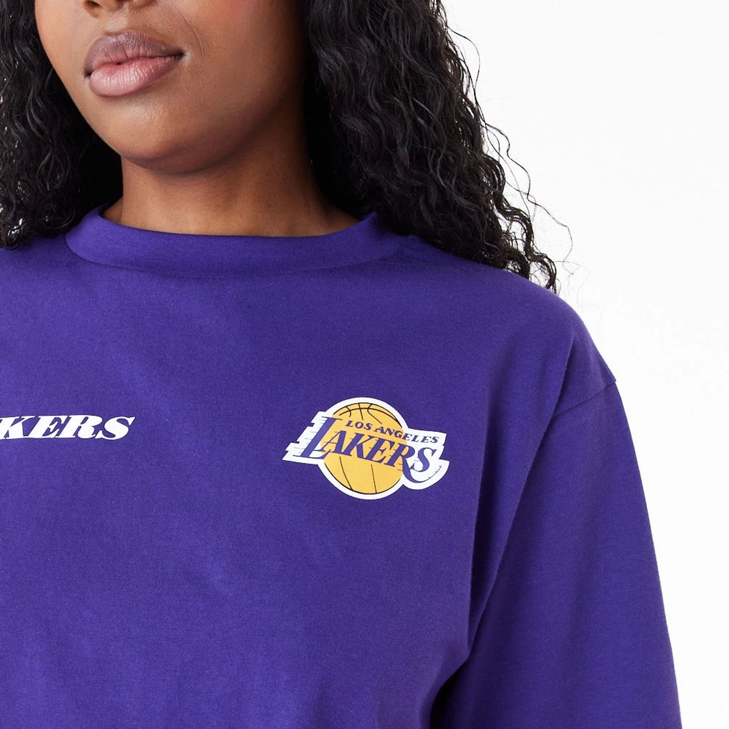 The Female model is wearing LA Lakers Womens NBA Team Logo Purple Crop T-Shirt 8