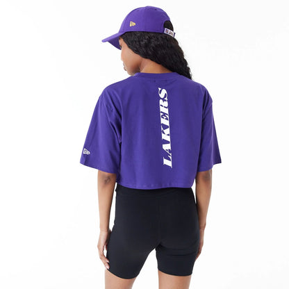 The Female model is wearing LA Lakers Womens NBA Team Logo Purple Crop T-Shirt 6