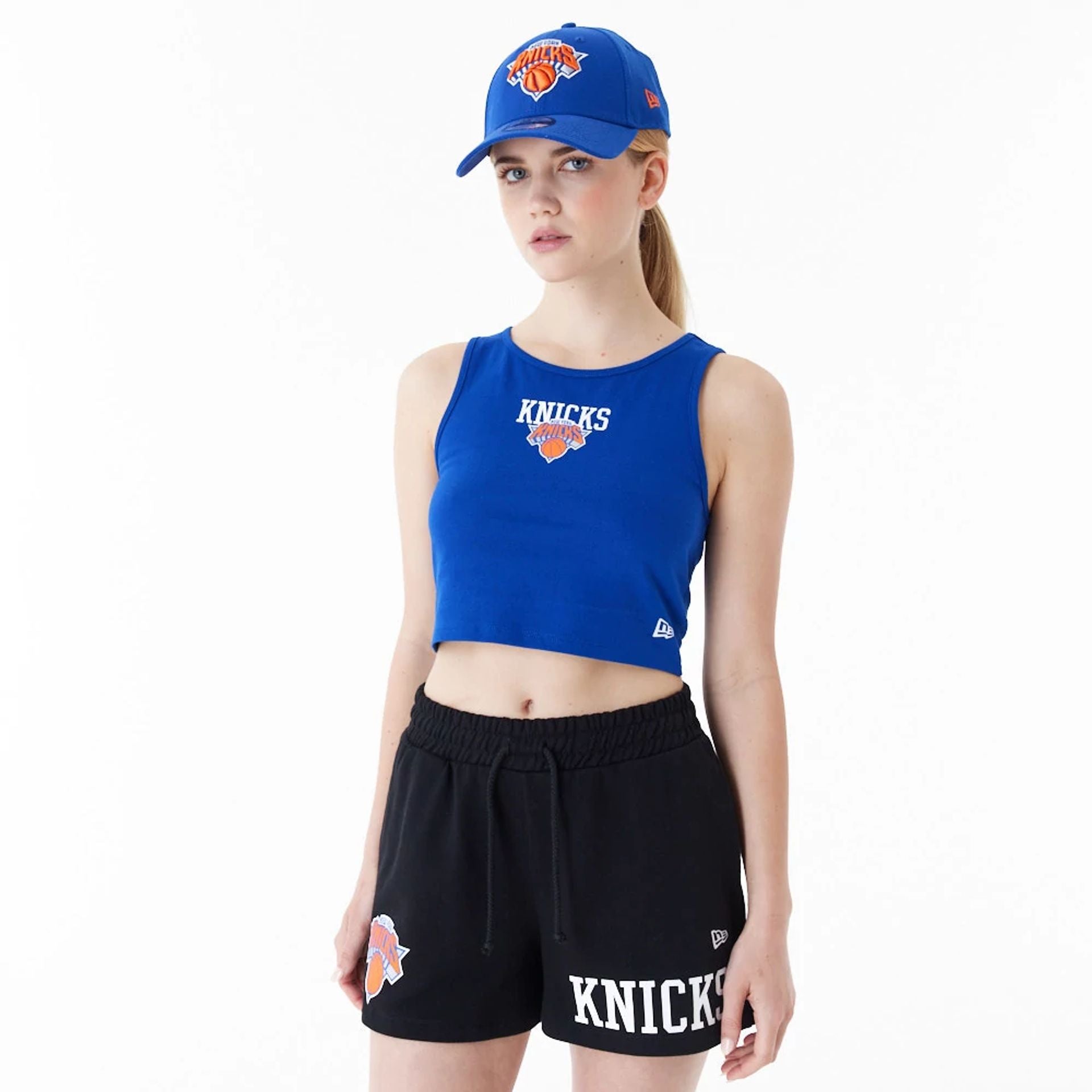 The Female model is wearing New York Knicks Womens NBA Team Logo Blue Crop Tank Top 1