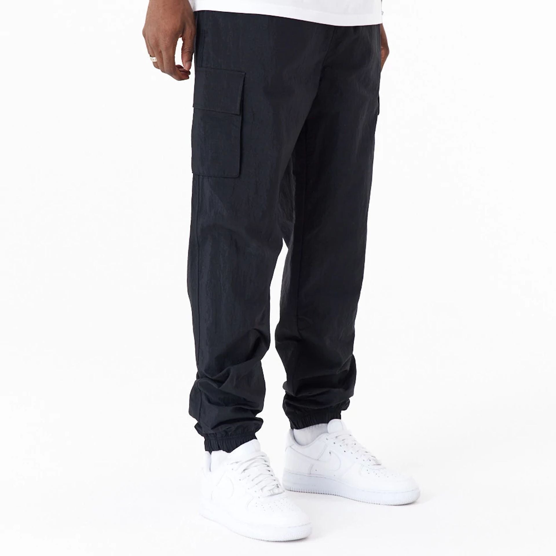 The Male model is wearing New Era Woven Black Joggers 8