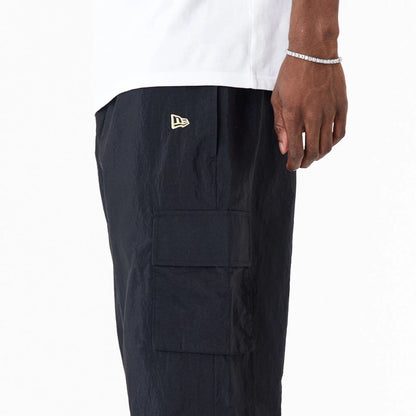 The Male model is wearing New Era Woven Black Joggers 6