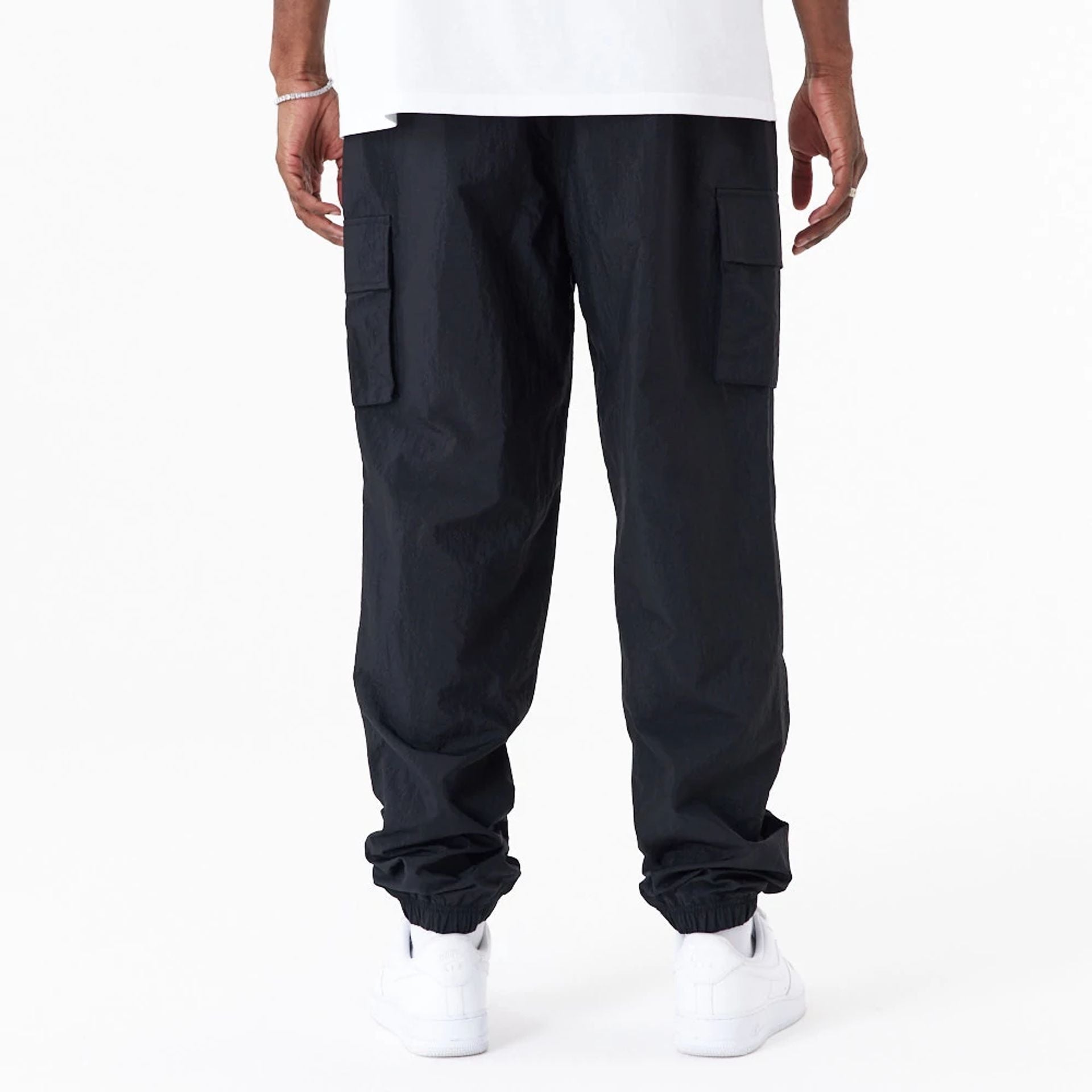 The Male model is wearing New Era Woven Black Joggers 2