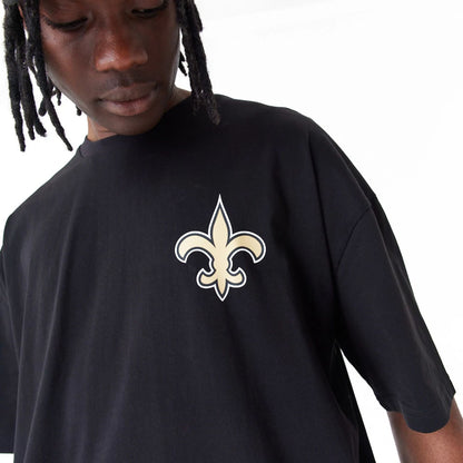 The Male model is wearing New Orleans Saints NFL Drop Shoulder Black Oversized T-Shirt 6