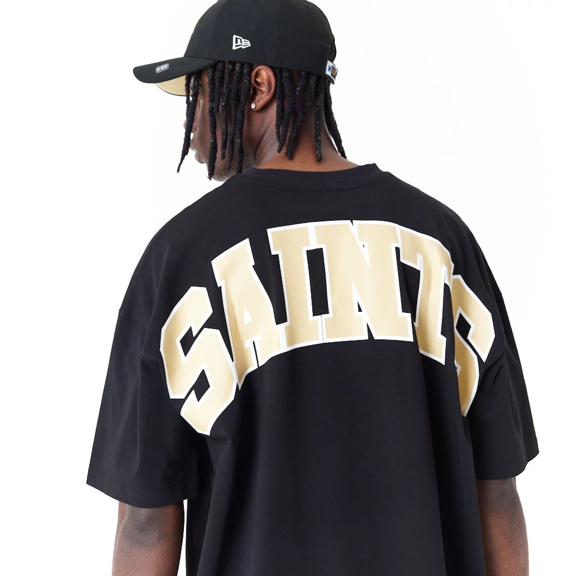 The Male model is wearing New Orleans Saints NFL Drop Shoulder Black Oversized T-Shirt 2