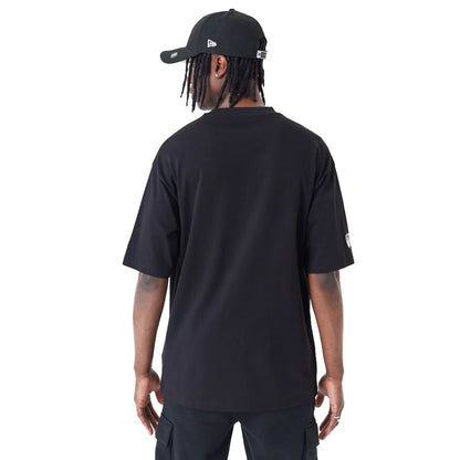 The Male model is wearing New Orleans Saints NFL Black Oversized T-Shirt 2