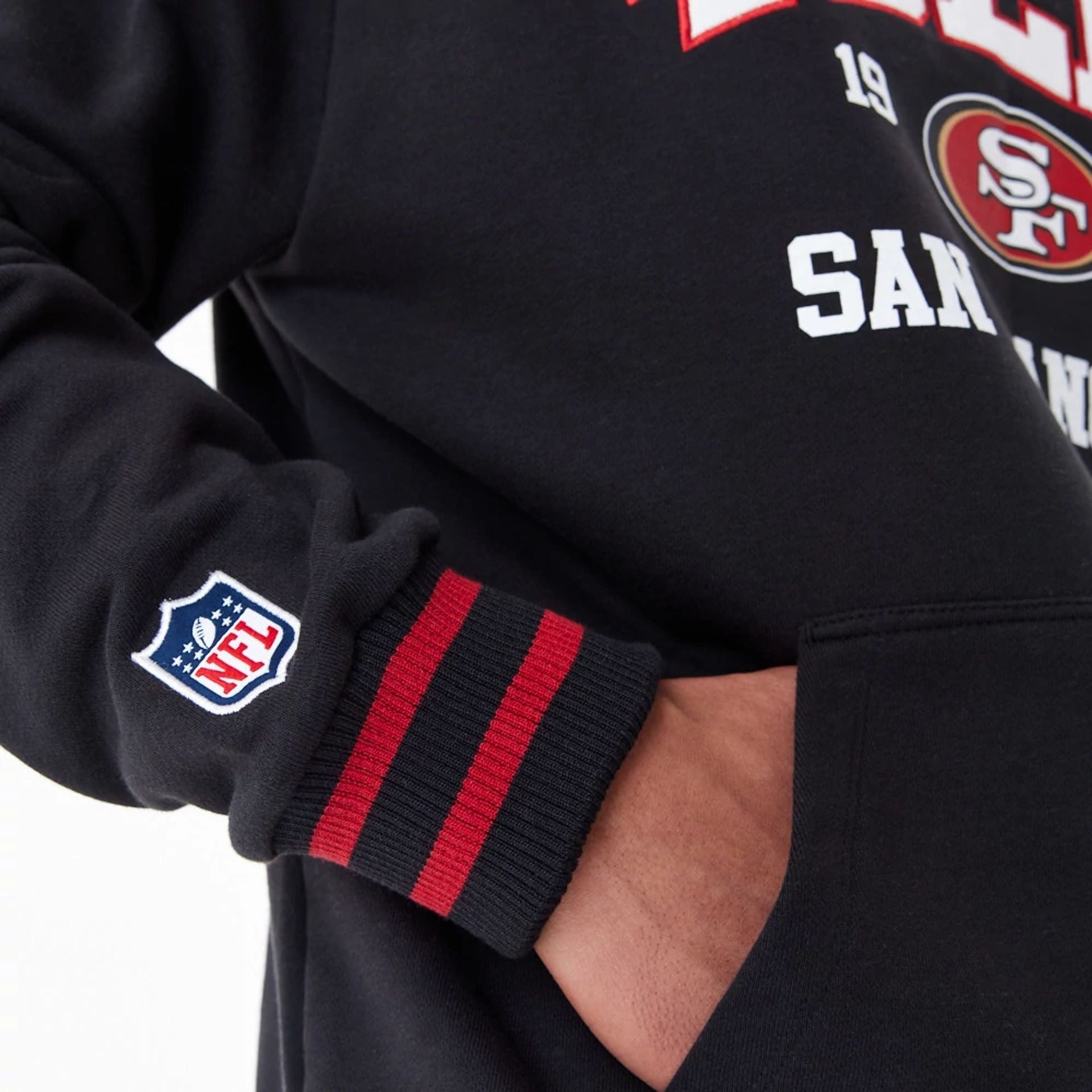 The Male model is wearing San Francisco 49Ers NFL Black Oversized Pullover Hoodie 5