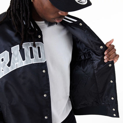 The Male model is wearing Las Vegas Raiders NFL Shiny Satin Black Bomber Jacket 4