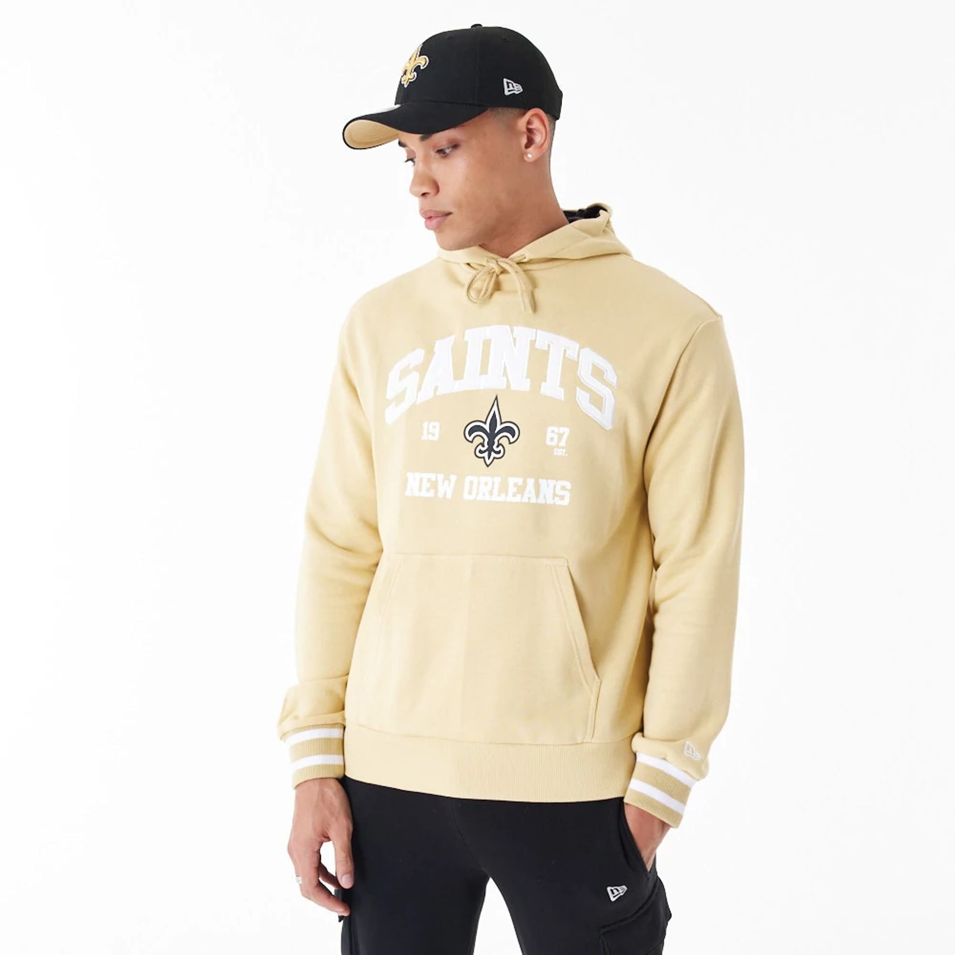 The Male model is wearing New Orleans Saints NFL Stone Oversized Pullover Hoodie 8