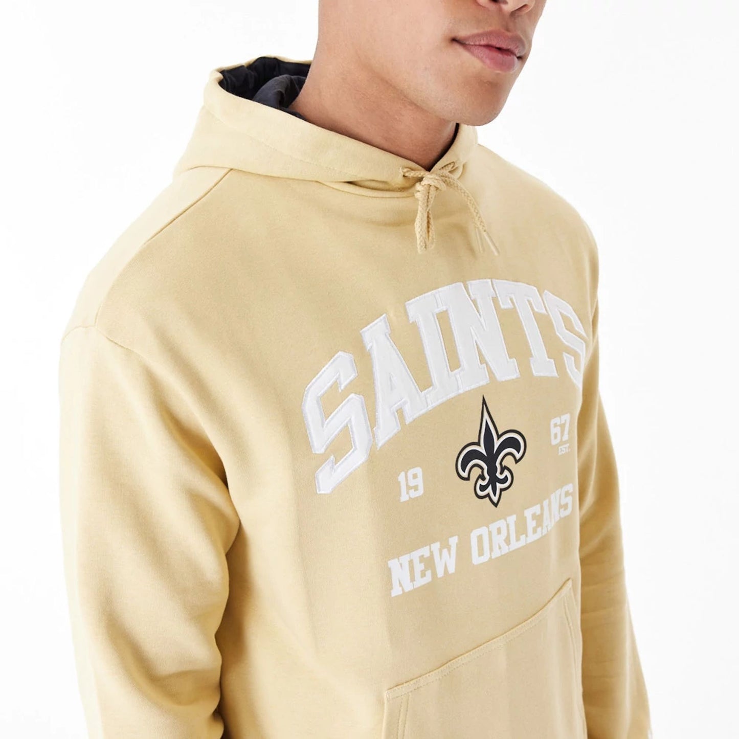 The Male model is wearing New Orleans Saints NFL Stone Oversized Pullover Hoodie 3