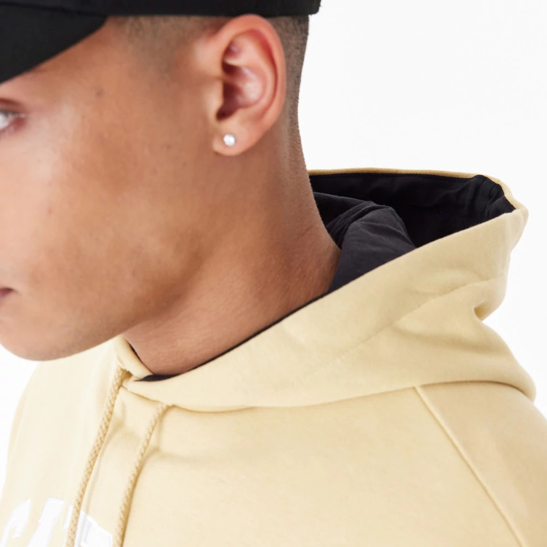 The Male model is wearing New Orleans Saints NFL Stone Oversized Pullover Hoodie 4