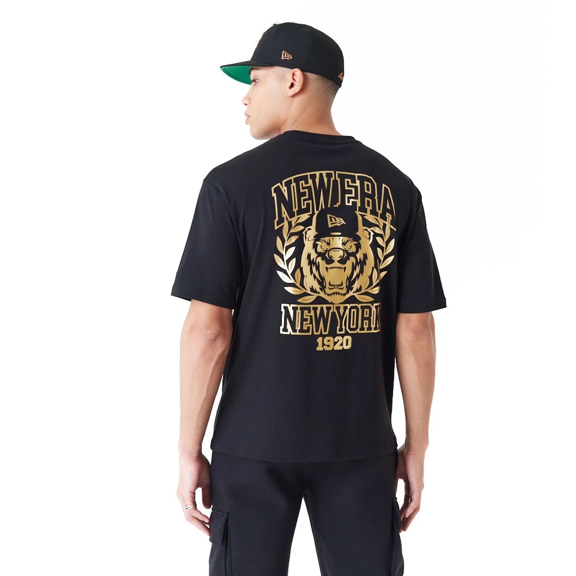 The Male model is wearing New Era Graphic Black Oversized T-Shirt 2