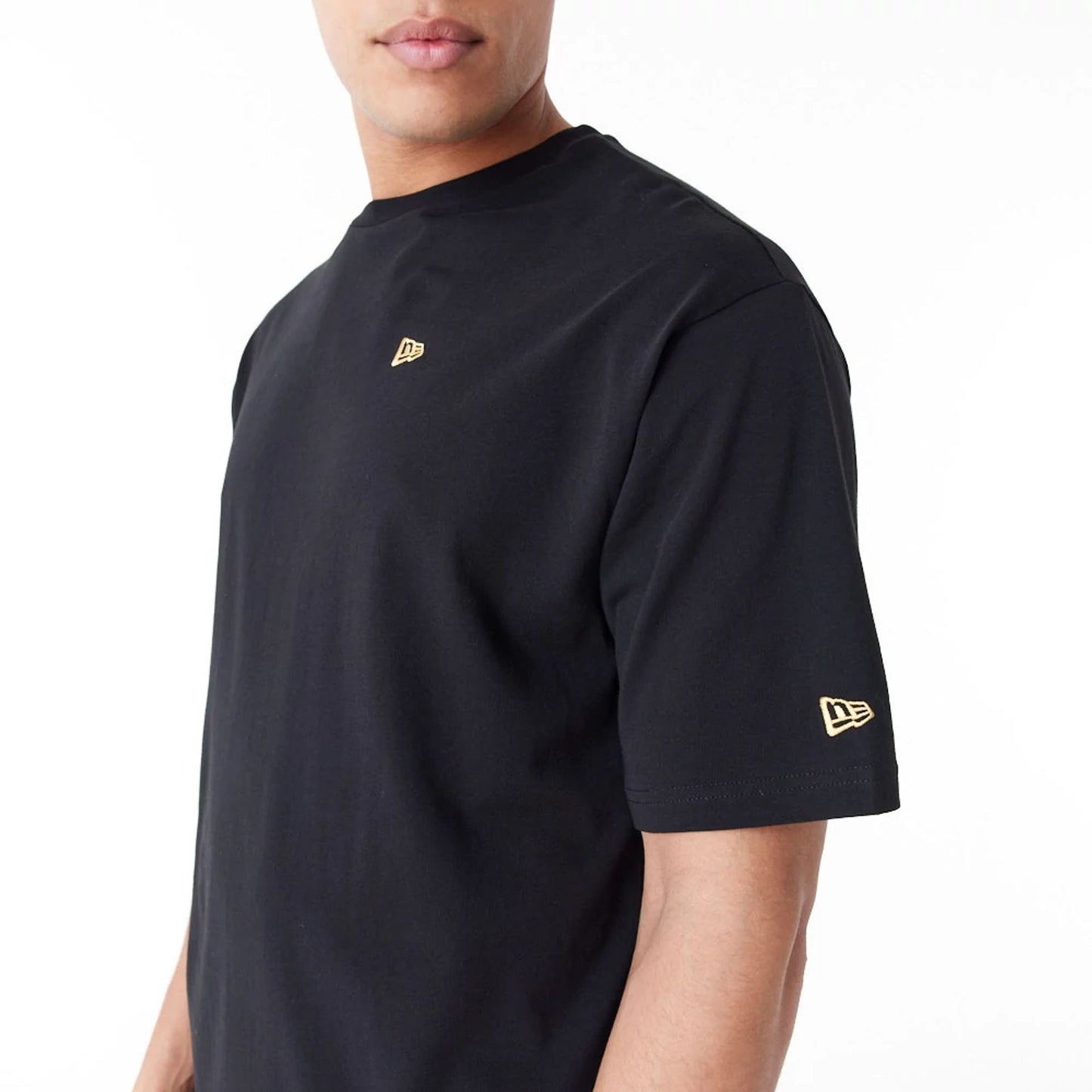 The Male model is wearing New Era Graphic Black Oversized T-Shirt 3