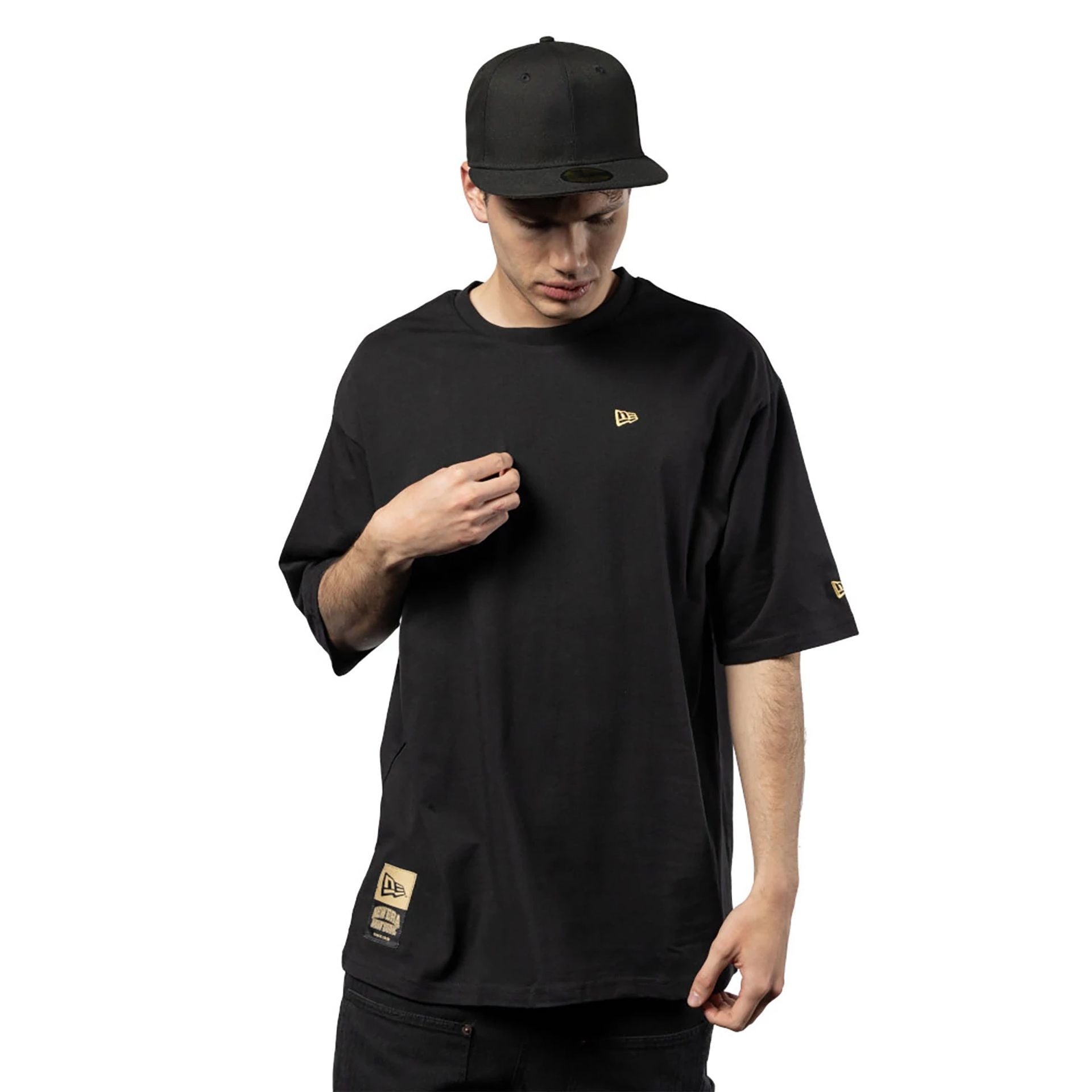 The Male model is wearing New Era Graphic Black Oversized T-Shirt 2