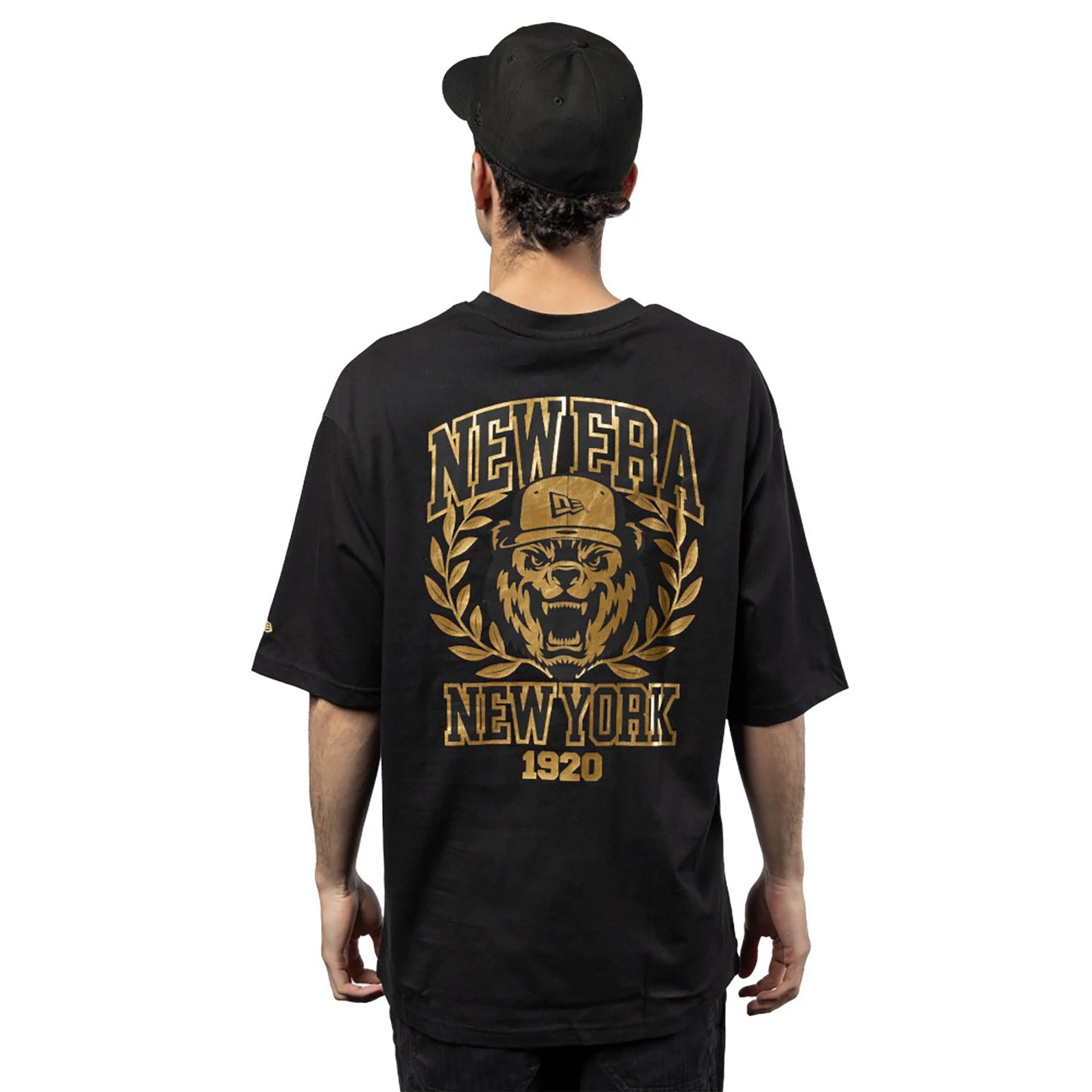 The Male model is wearing New Era Graphic Black Oversized T-Shirt 1