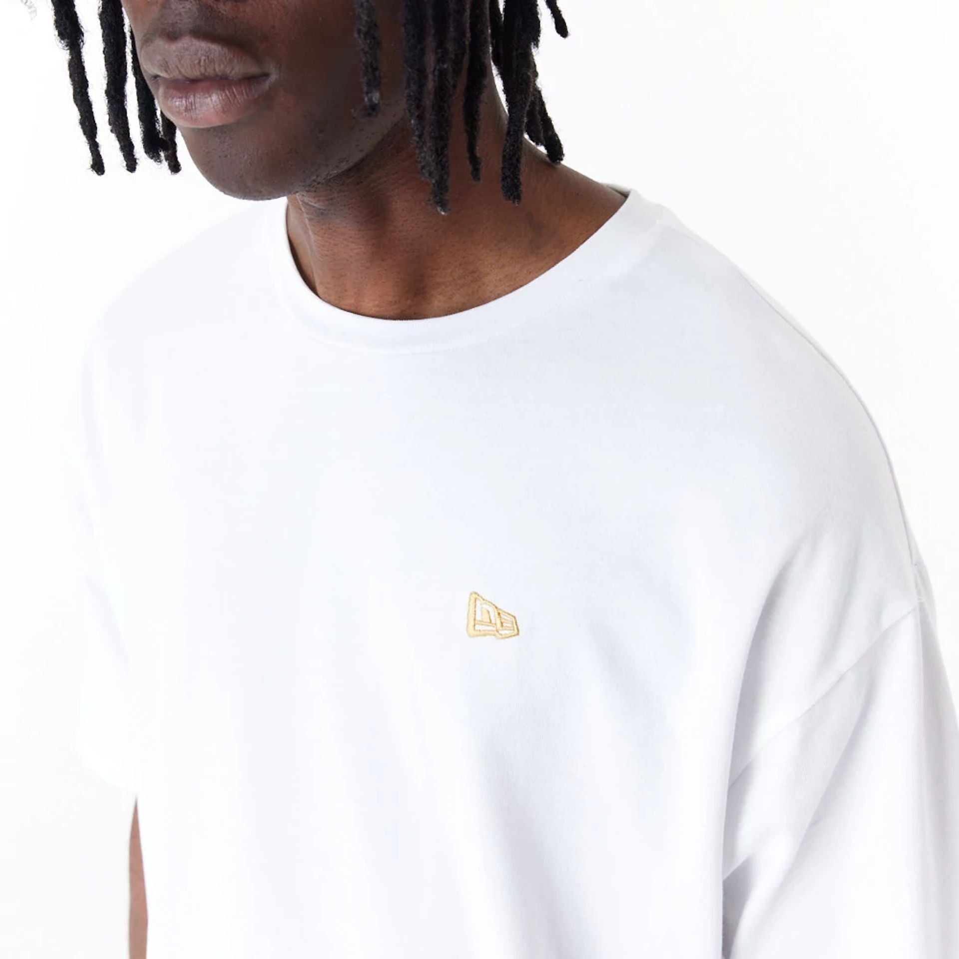 The Male model is wearing New Era Sticker White Oversized T-Shirt 6