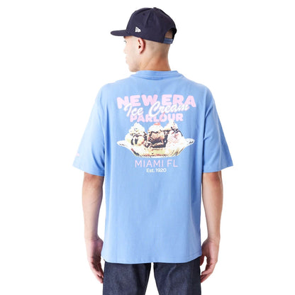 The Male model is wearing New Era Food Graphic Blue Oversized T-Shirt 6