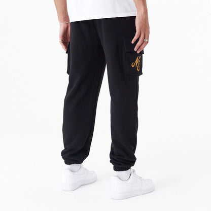 The Male model is wearing New Era Script Black Cargo Joggers 2