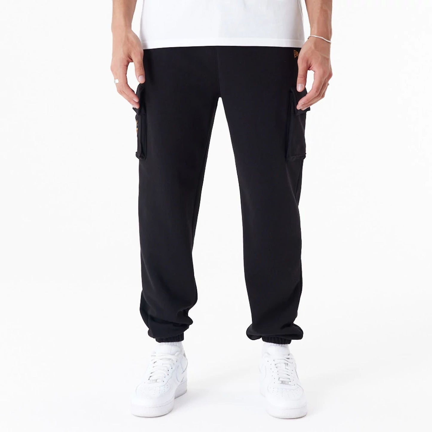 The Male model is wearing New Era Script Black Cargo Joggers 1