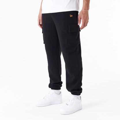 The Male model is wearing New Era Script Black Cargo Joggers 4