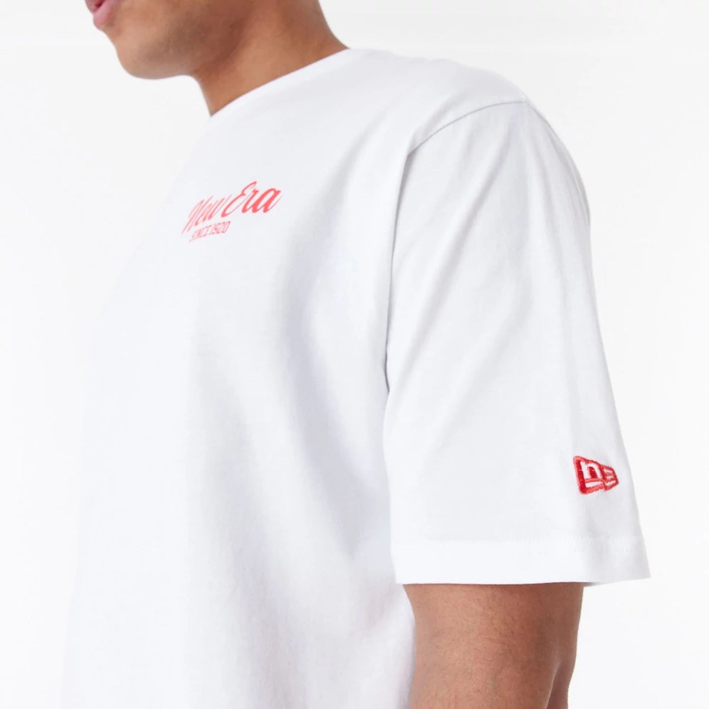 The Male model is wearing New Era Cactus Graphic White Oversized T-Shirt 4