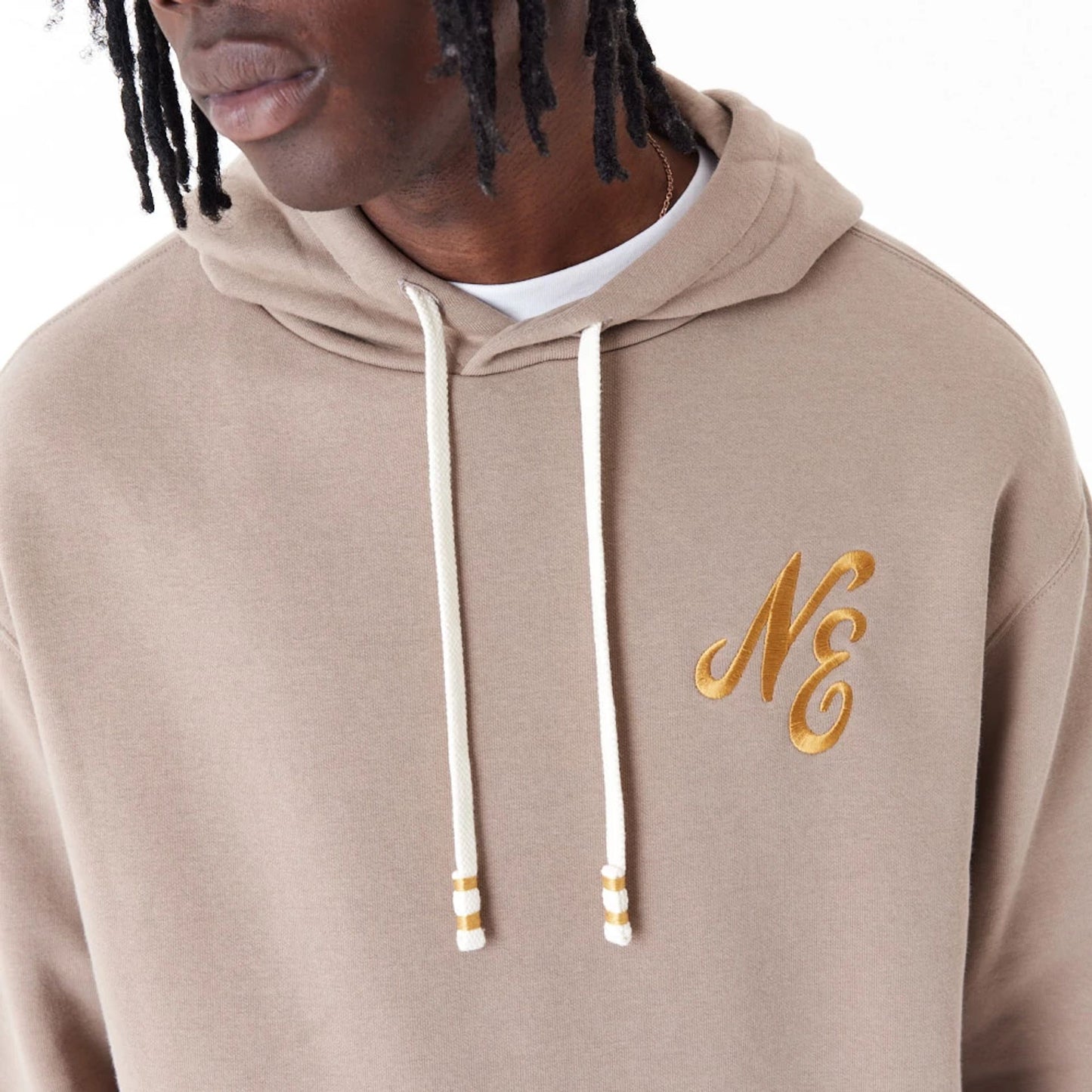 The Male model is wearing New Era Script Logo Brown Oversized Pullover Hoodie 4