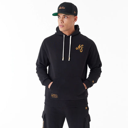 The Male model is wearing New Era Script Logo Black Oversized Pullover Hoodie 10