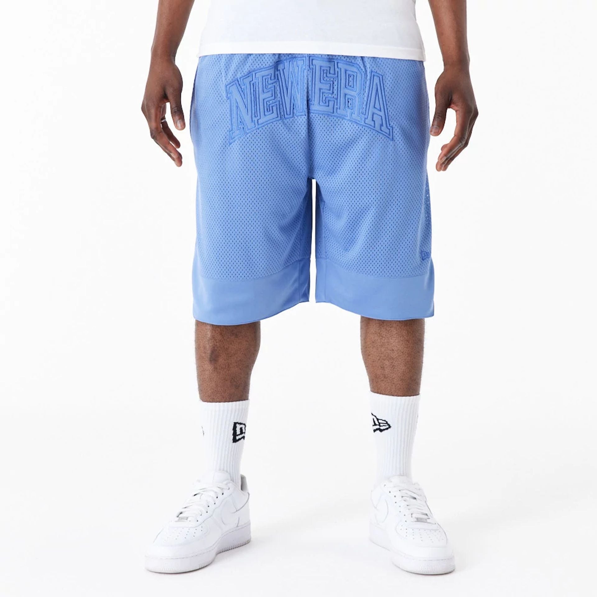 The Male model is wearing New Era Arch Logo Blue Mesh Shorts 1