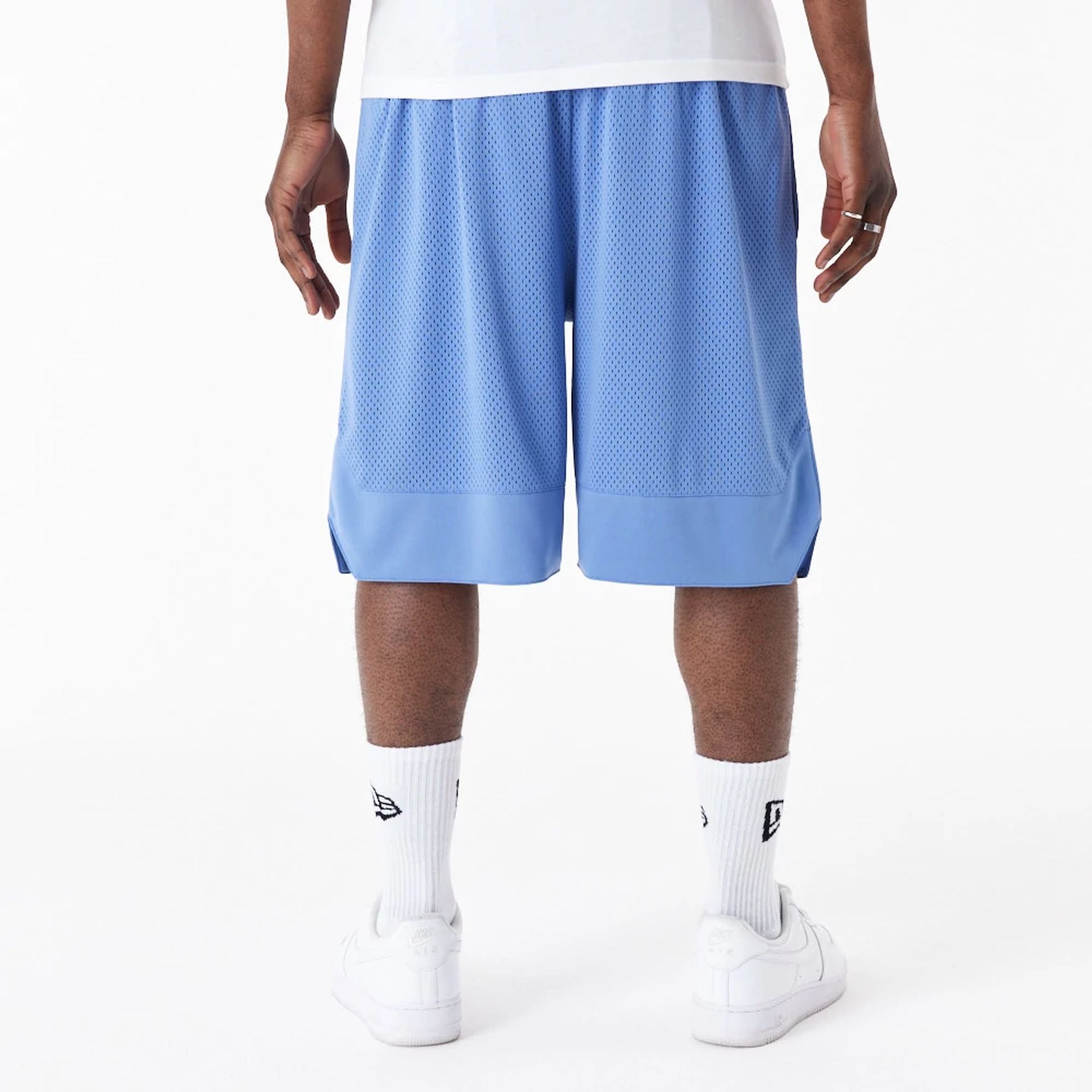 The Male model is wearing New Era Arch Logo Blue Mesh Shorts 3