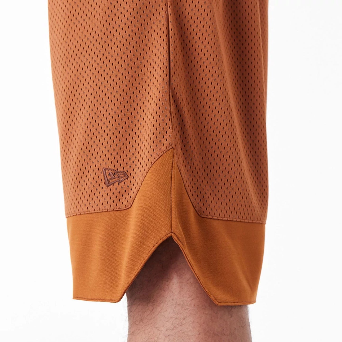 The Male model is wearing New Era Arch Logo Brown Mesh Shorts 3