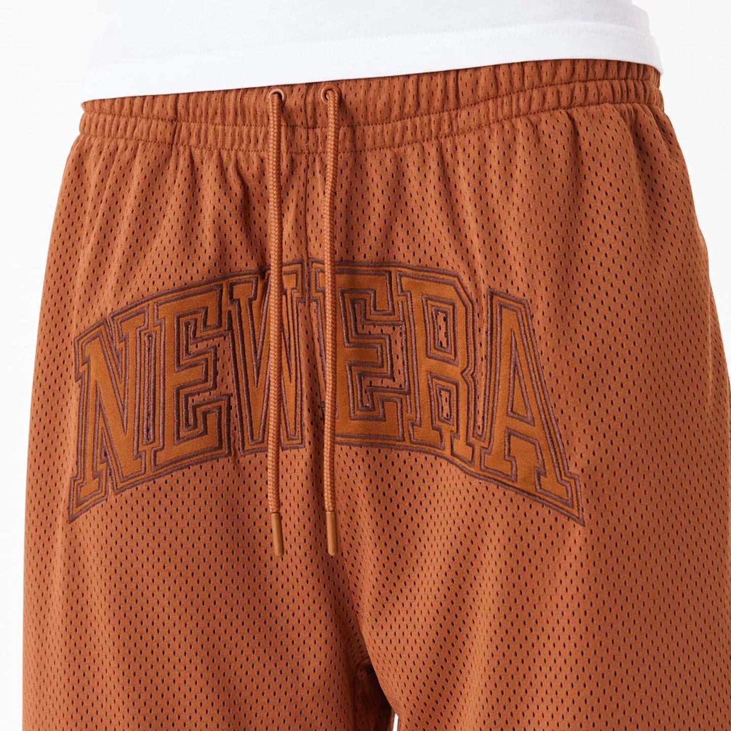 The Male model is wearing New Era Arch Logo Brown Mesh Shorts 6