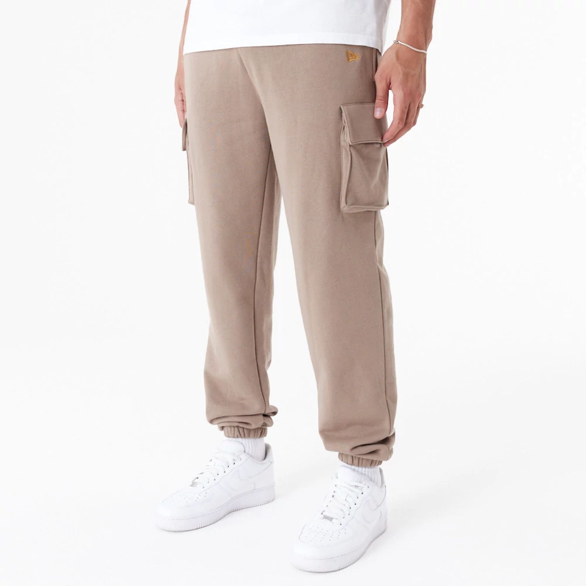 The Male model is wearing New Era Script Brown Cargo Joggers 1