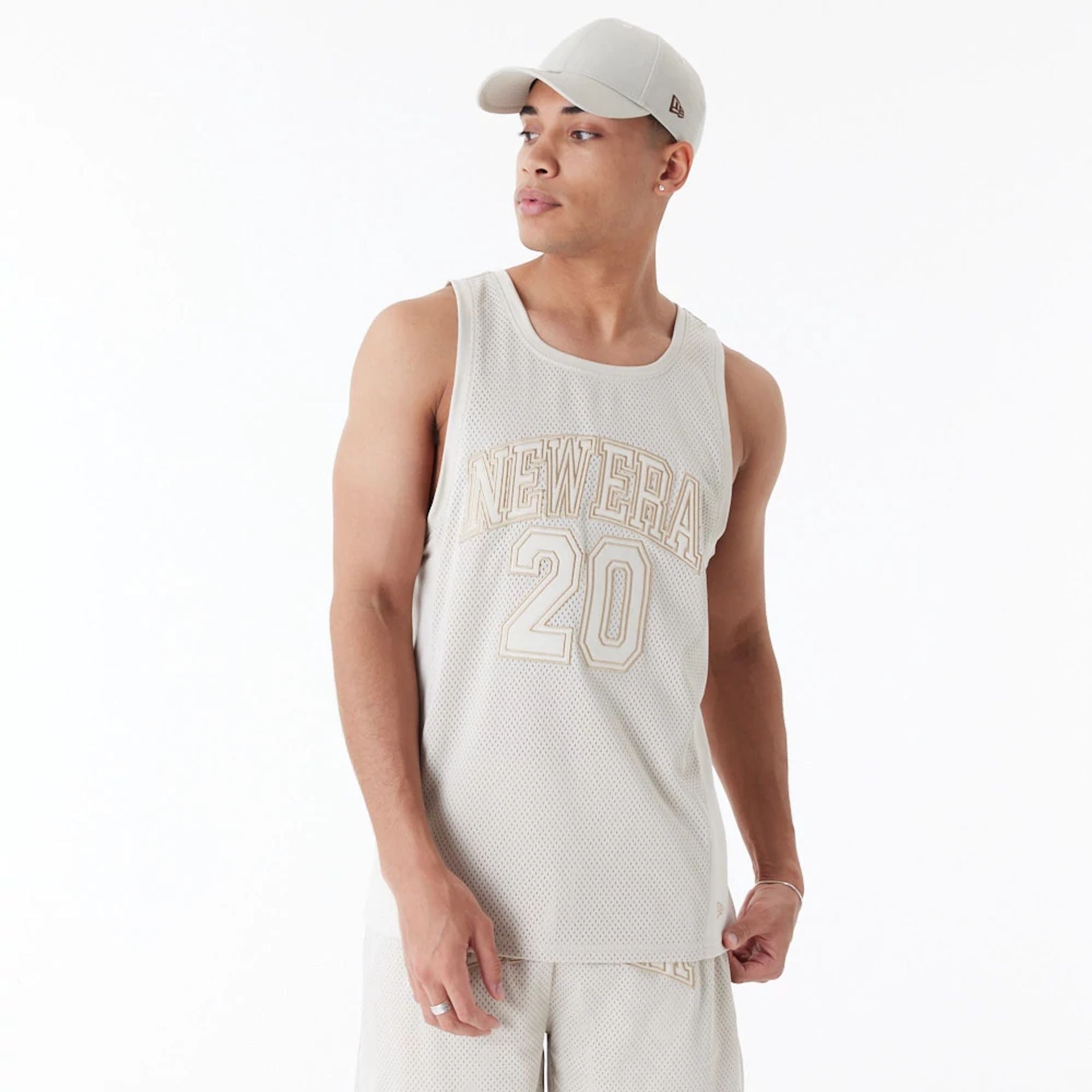 The Male model is wearing New Era Arch Logo Stone Mesh Tank Top 1